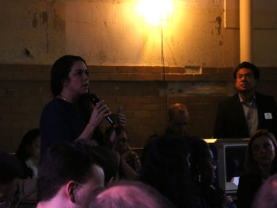 Audience member asking a question during a panel